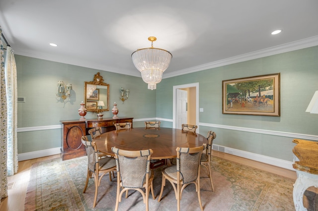1821 Delong Rd, Lexington, KY 40515 - dining room with a chandelier, visible vents, baseboards, ornamental molding, and wood finished floors