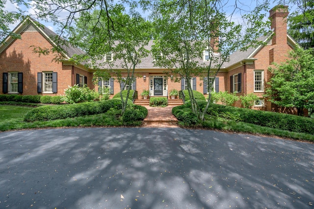 1821 Delong Rd, Lexington, KY 40515 - ranch-style house featuring a chimney and brick siding