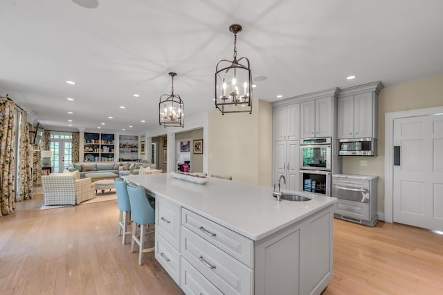 1821 Delong Rd, Lexington, KY 40515 - kitchen with recessed lighting, a chandelier, stainless steel appliances, light countertops, and a sink