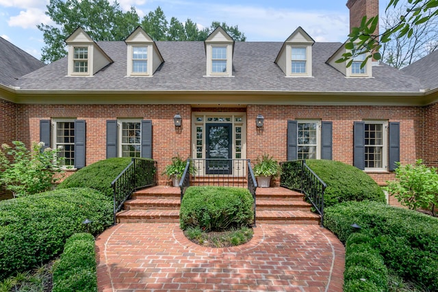1821 Delong Rd, Lexington, KY 40515 - new england style home with a shingled roof and brick siding