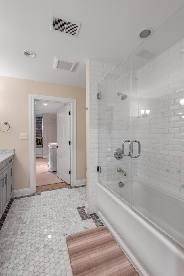 1821 Delong Rd, Lexington, KY 40515 - full bath with vanity, bath / shower combo with glass door, tile patterned floors, visible vents, and baseboards