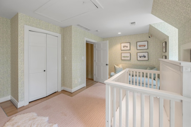 1821 Delong Rd, Lexington, KY 40515 - bedroom featuring visible vents, wallpapered walls, light wood-type flooring, and baseboards