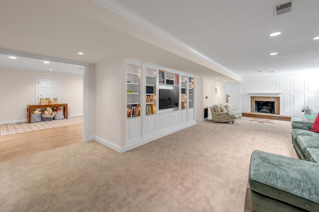1821 Delong Rd, Lexington, KY 40515 - carpeted living room featuring recessed lighting, a fireplace, baseboards, visible vents, and crown molding