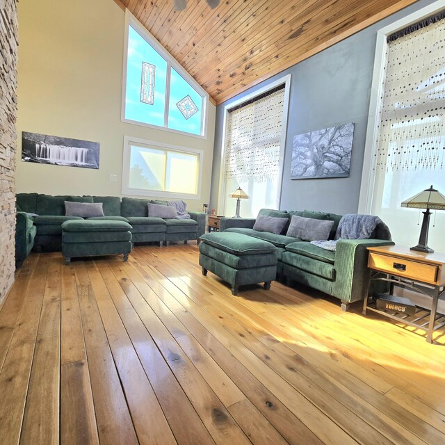 living area with wood ceiling, high vaulted ceiling, and hardwood / wood-style floors