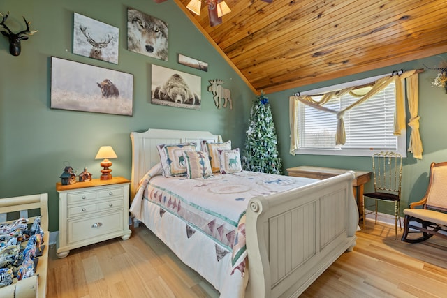 bedroom featuring light wood-style flooring, wooden ceiling, and vaulted ceiling