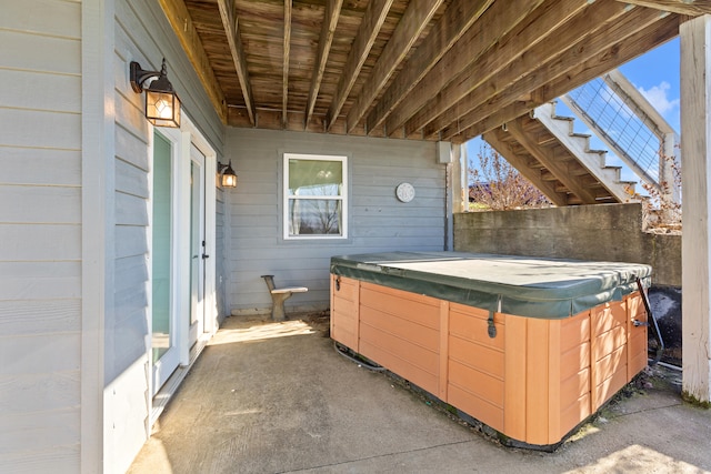 view of patio / terrace with a hot tub