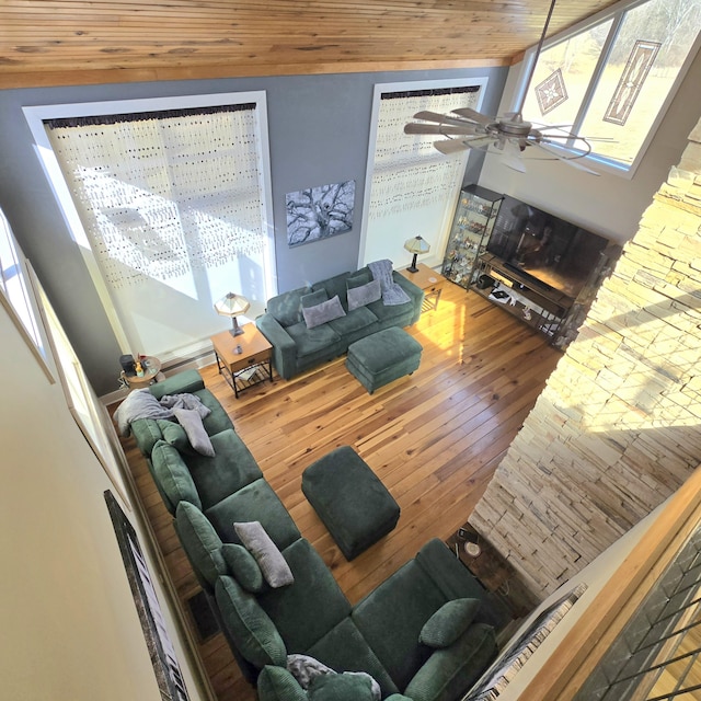 living room with a fireplace, wooden ceiling, a ceiling fan, and hardwood / wood-style floors