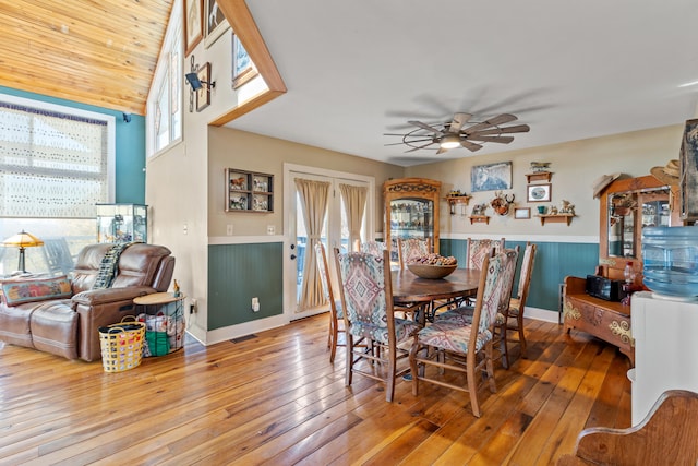 dining area featuring visible vents, wood-type flooring, a healthy amount of sunlight, and ceiling fan