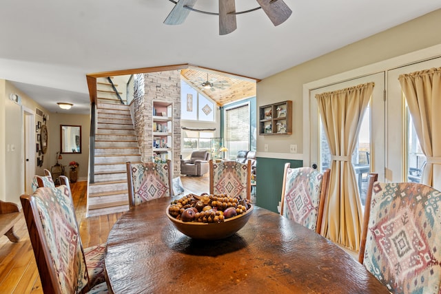 dining area with wood ceiling, stairs, lofted ceiling, wood finished floors, and a ceiling fan