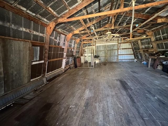 miscellaneous room with hardwood / wood-style flooring and lofted ceiling