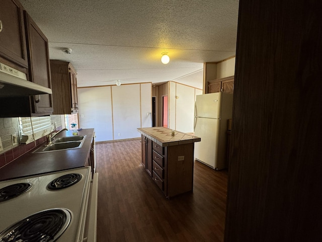 kitchen with sink, dark wood-type flooring, white appliances, decorative backsplash, and a kitchen island