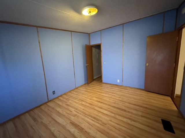 unfurnished bedroom featuring light hardwood / wood-style floors