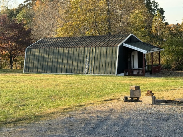 view of outbuilding featuring a yard