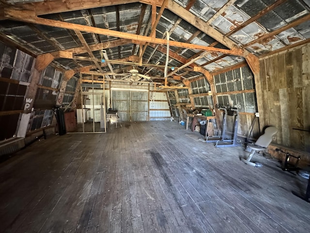 misc room featuring wood-type flooring and lofted ceiling