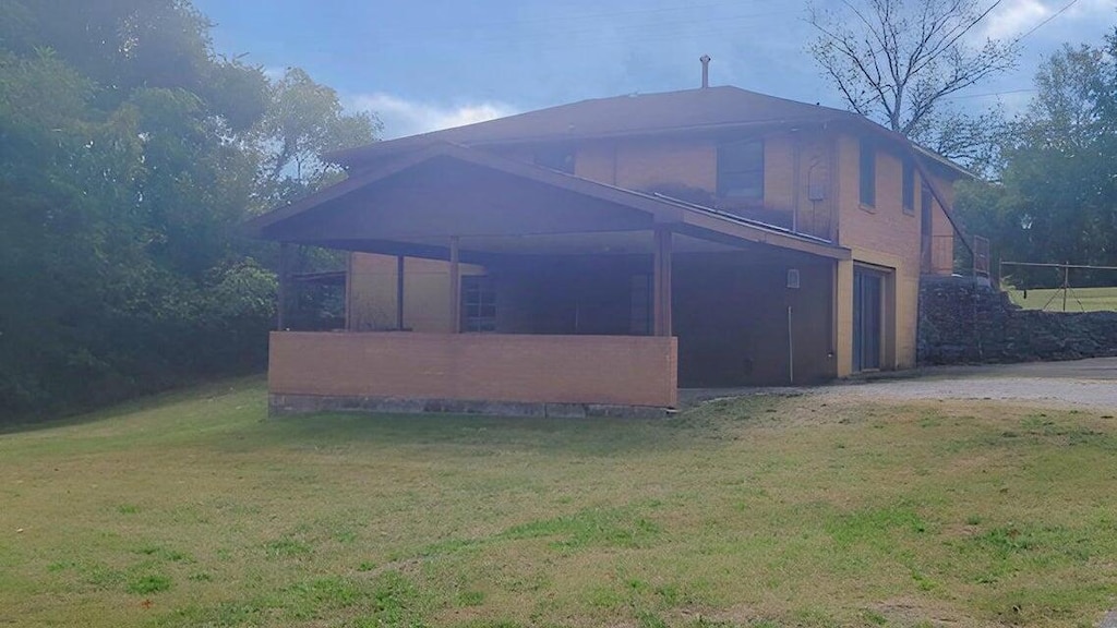 exterior space featuring a yard and a garage