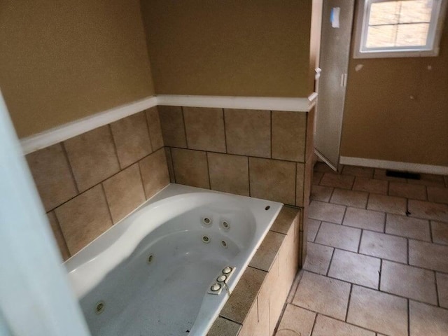 bathroom featuring tiled bath