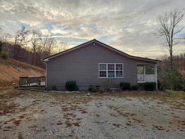 view of property exterior at dusk