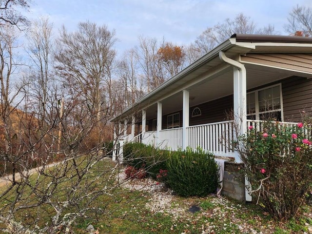 view of property exterior with a porch