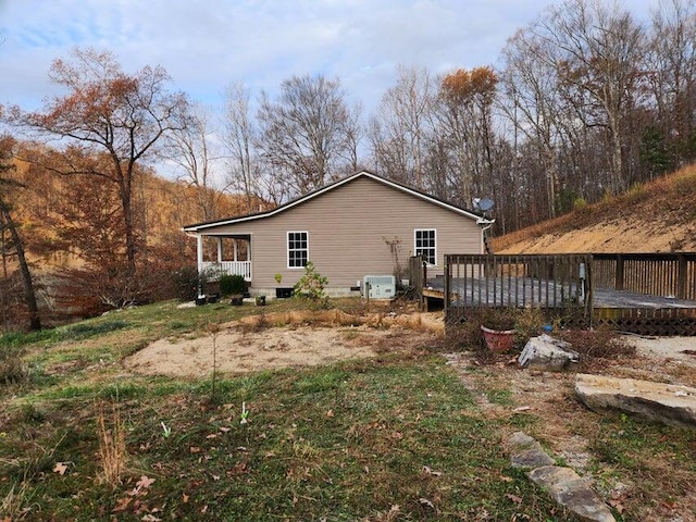 view of side of property with a wooden deck