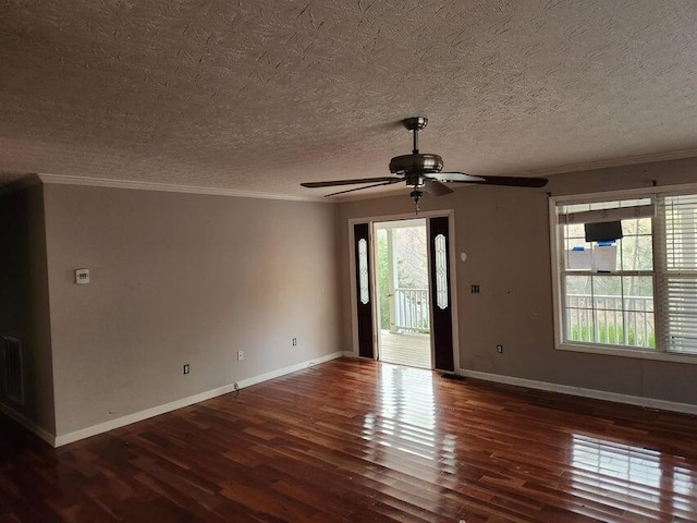 unfurnished room with ceiling fan, a healthy amount of sunlight, dark hardwood / wood-style flooring, and a textured ceiling