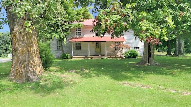 view of yard with covered porch