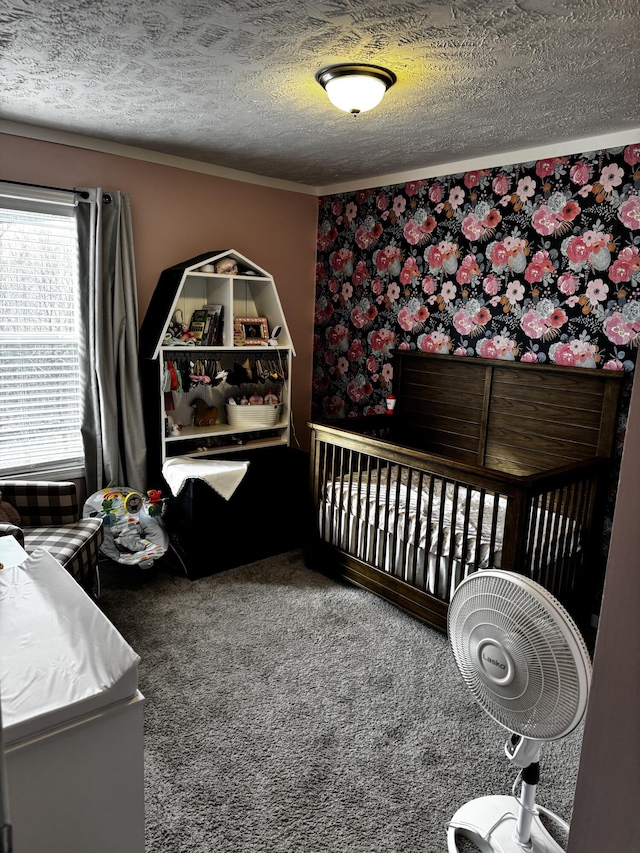 carpeted bedroom featuring a textured ceiling