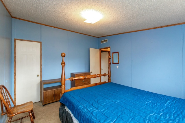 carpeted bedroom featuring a textured ceiling and ornamental molding