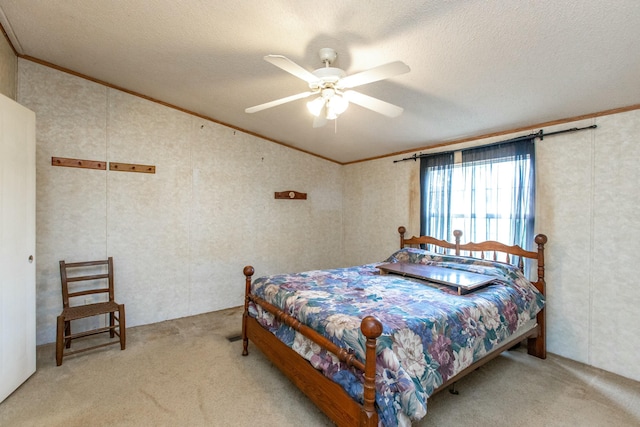 bedroom with carpet flooring, ceiling fan, and a textured ceiling