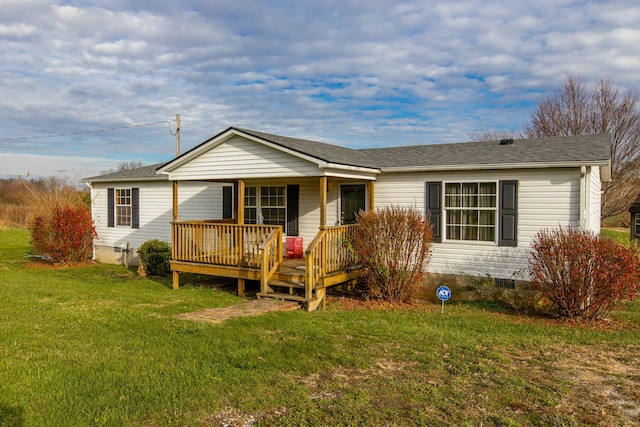 ranch-style home featuring a front yard