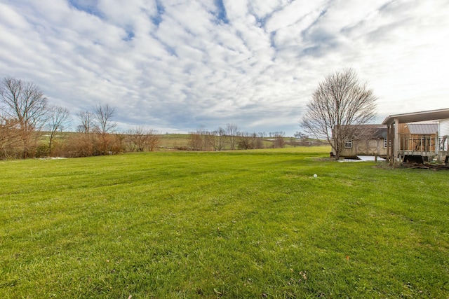 view of yard with a rural view