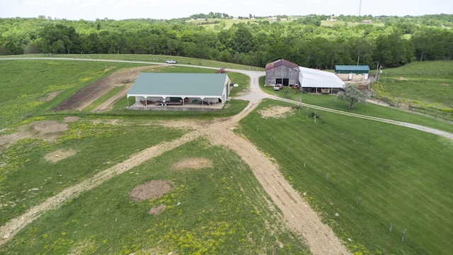 birds eye view of property with a rural view