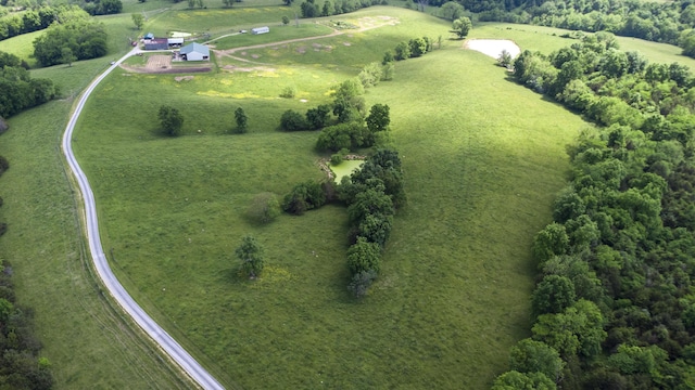 birds eye view of property with a rural view