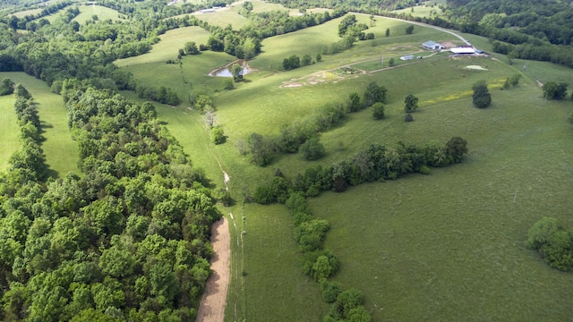 birds eye view of property featuring a water view and a rural view