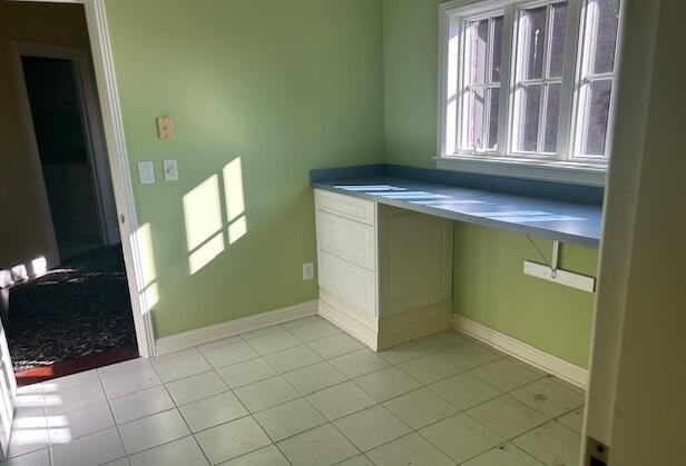 interior space featuring light tile patterned floors