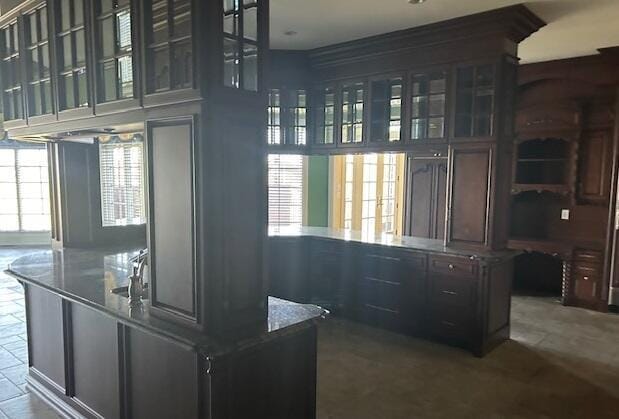 interior space featuring plenty of natural light and dark brown cabinets