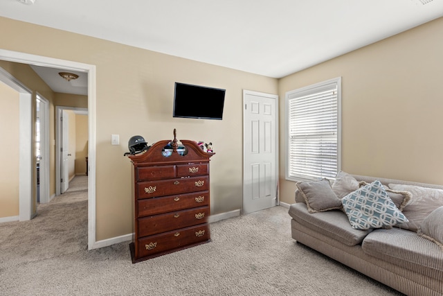 living room featuring light carpet