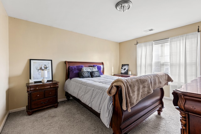 bedroom featuring light carpet