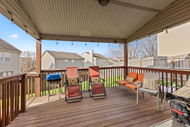 wooden terrace with a grill