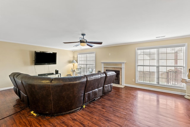 living room with ceiling fan, dark hardwood / wood-style flooring, and ornamental molding