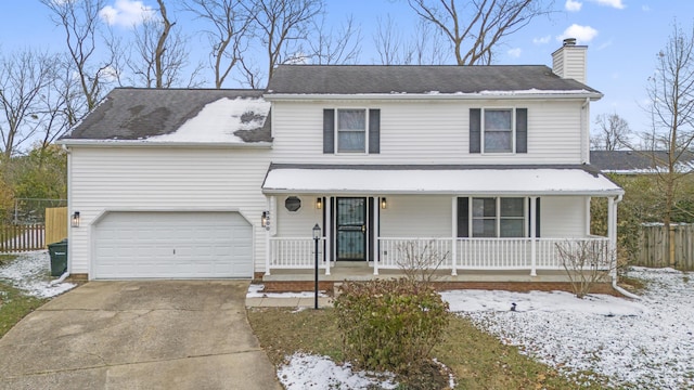 view of front of property with a porch and a garage