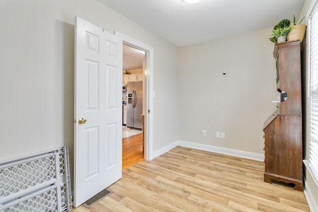 unfurnished room featuring light wood-type flooring