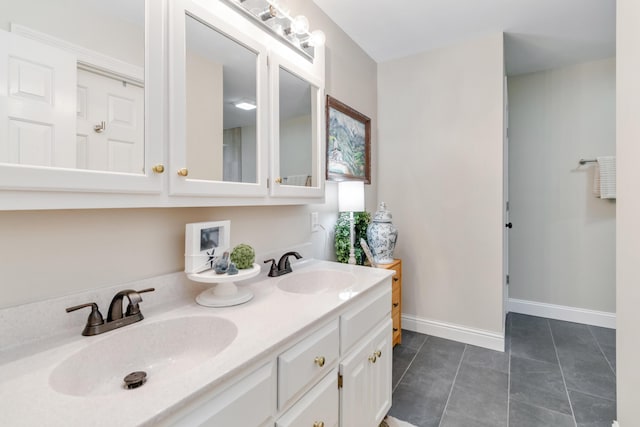 bathroom with tile patterned floors and vanity