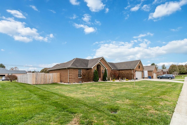 single story home featuring a garage and a front lawn