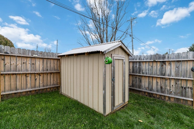 view of outbuilding with a lawn