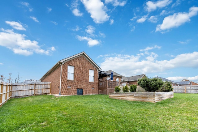 back of property featuring a lawn