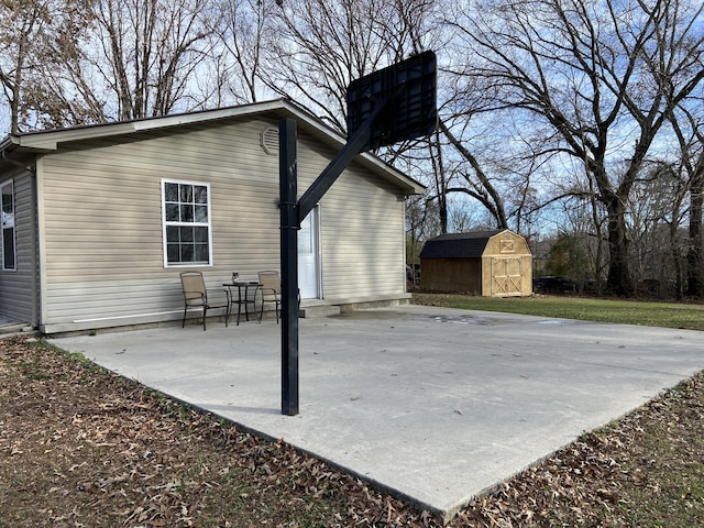 exterior space featuring a shed and a patio