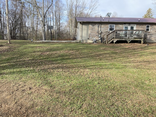 view of yard with a wooden deck