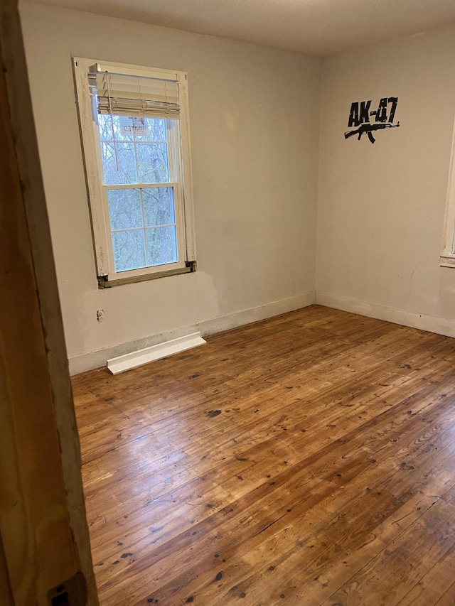 empty room with wood-type flooring