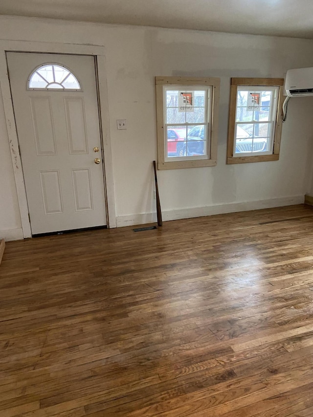 entrance foyer featuring ceiling fan and dark hardwood / wood-style flooring