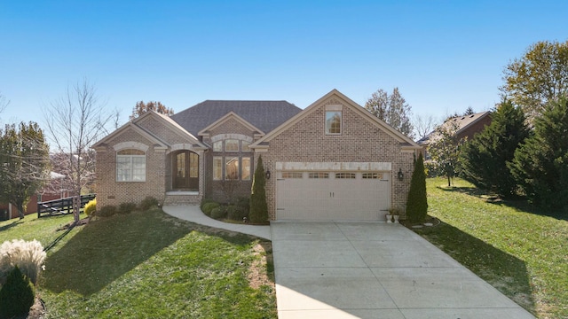 view of front of property featuring a garage and a front lawn